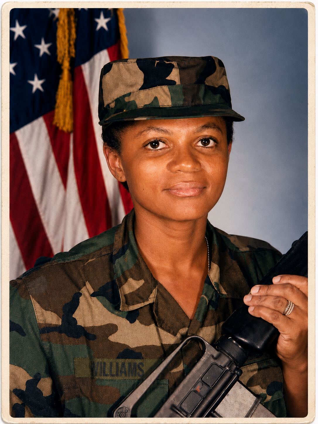 Alice Small, U.S. Army veteran, daughter and caregiver, in military uniform before the American flag